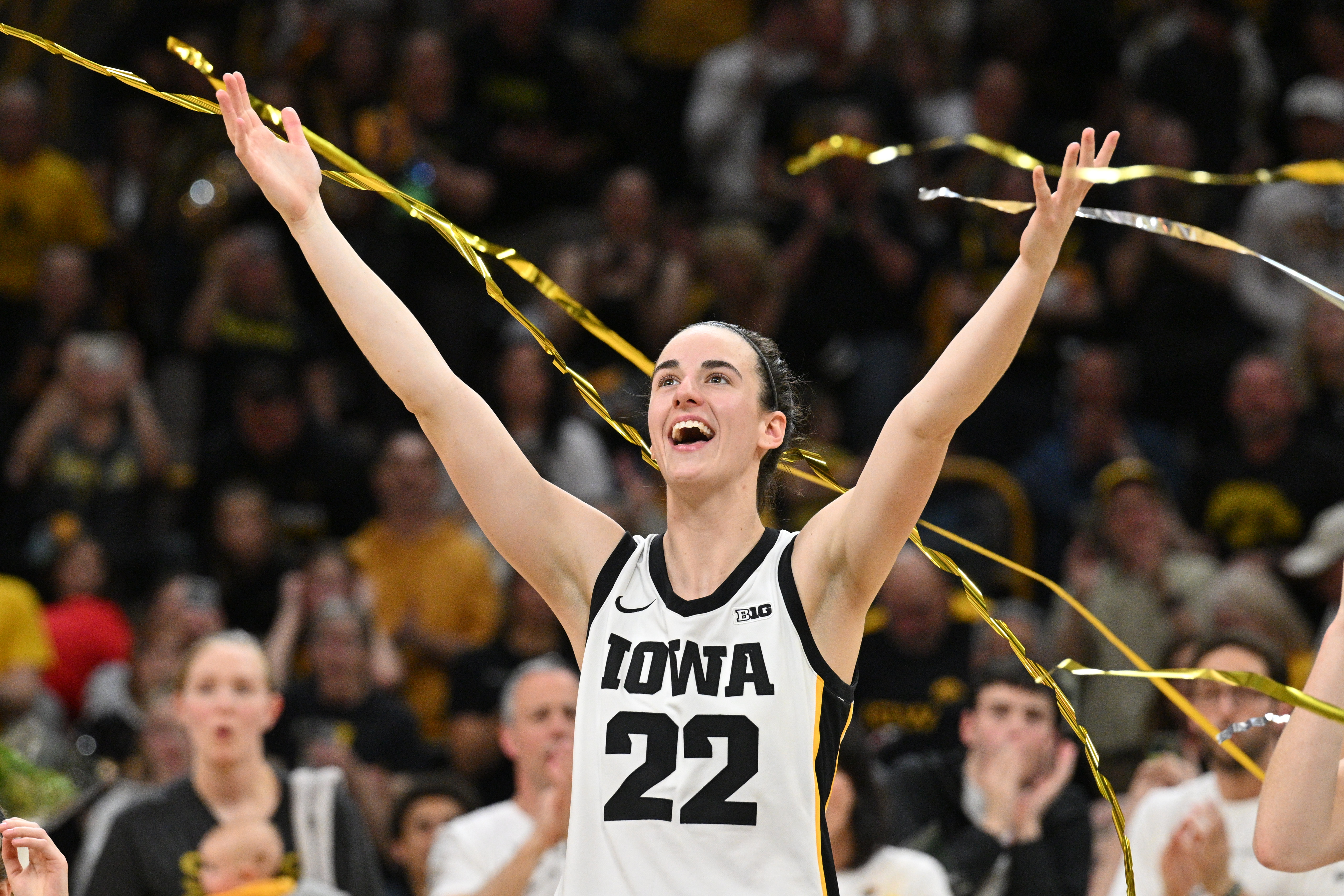 Iowa Hawkeyes guard Caitlin Clark (22) reacts during senior day after the game against the Ohio State Buckeyes. Clark broke the NCAA basketball all-time scoring record during the second quarter