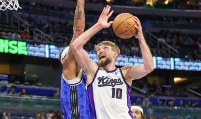 Mar 23, 2024; Orlando, Florida, USA; Sacramento Kings forward Domantas Sabonis (10) goes to the basket against Orlando Magic forward Paolo Banchero (5) during the first quarter at KIA Center. 