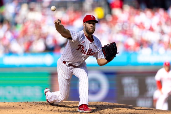 Mar 29, 2024; Philadelphia, Pennsylvania, USA; Philadelphia Phillies starting pitcher Zack Wheeler (45) throws a pitch against the Atlanta Braves on opening day at Citizens Bank Park. Mandatory Credit: