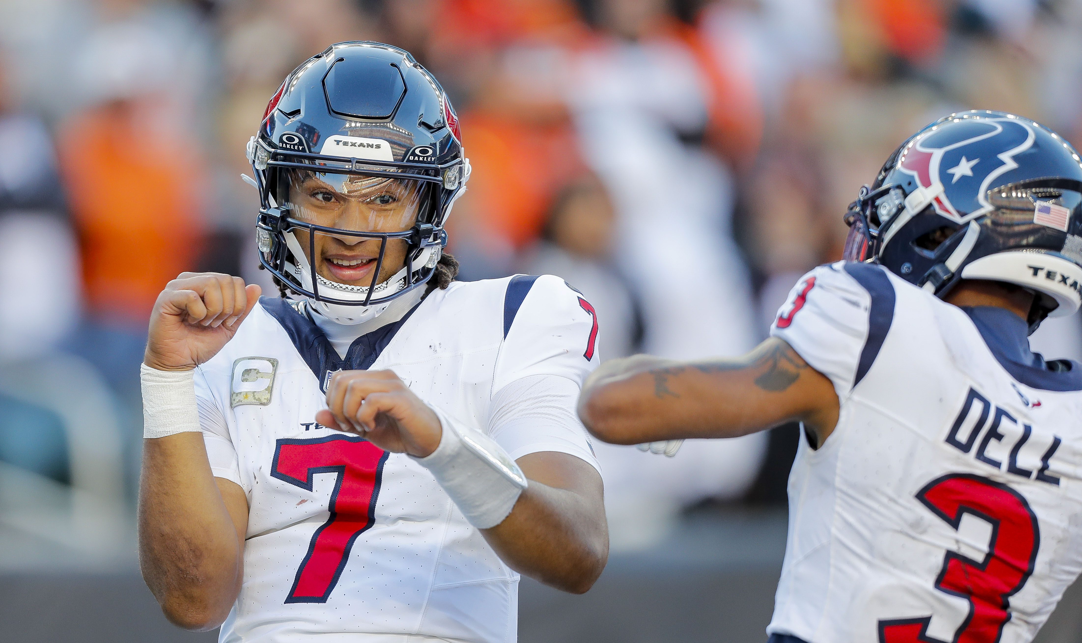 Nov 12, 2023; Cincinnati, Ohio, USA; Houston Texans quarterback C.J. Stroud (7) reacts after scoring a touchdown with wide receiver Tank Dell (3) in the second half against the Cincinnati Bengals at Paycor Stadium.