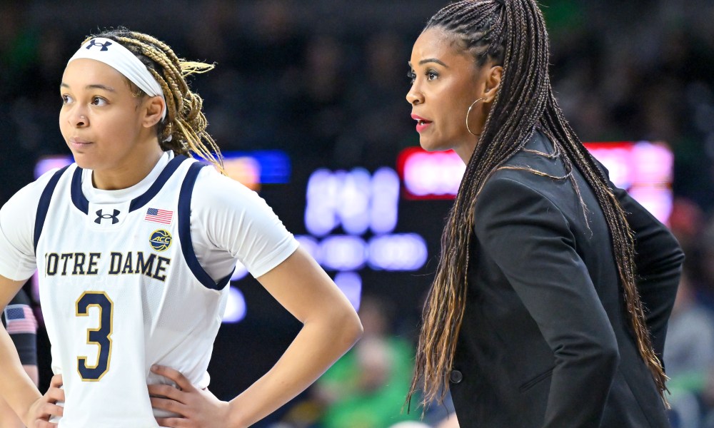 Notre Dame Fighting Irish head coach Niele Ivey talks to guard Hannah Hidalgo (3) in the first half against the Boston College Eagles at the Purcell Pavilion.